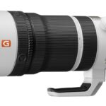 Sony FE 100-400mm F4.5 GM OSS (SEL100400MC) lens on a table – $4,299.99 on Amazon US.