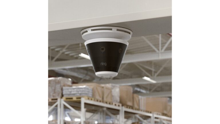 Ring Elite 4K security camera mounted on ceiling in warehouse with 360-degree field of view
